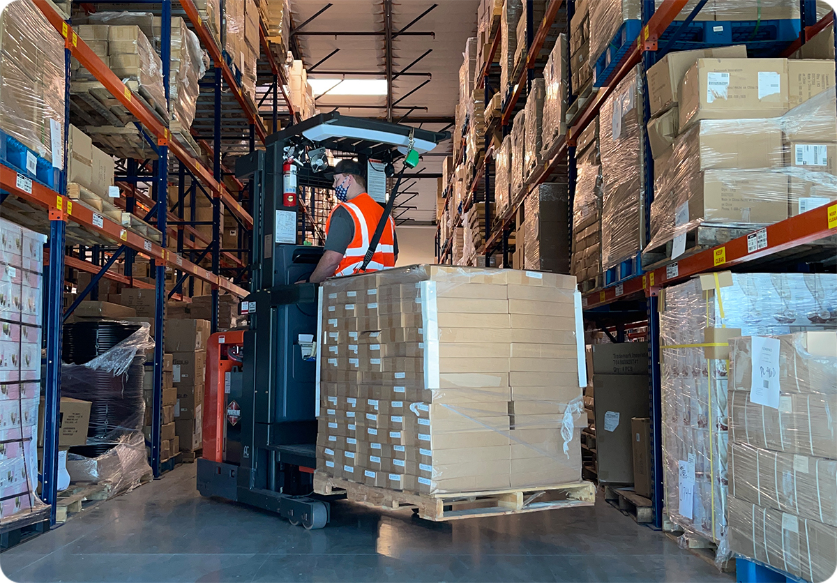One of Elevate Fulfillment's forklift operators navigating a warehouse aisle.